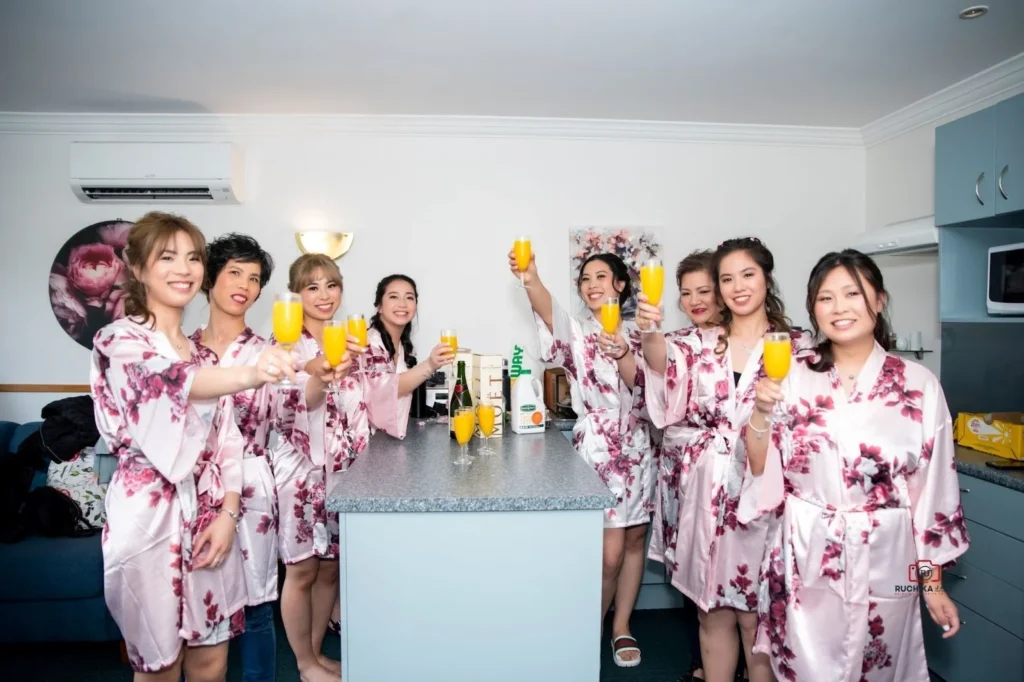 Bride enjoying juice with girlfriends at bachelorette party
