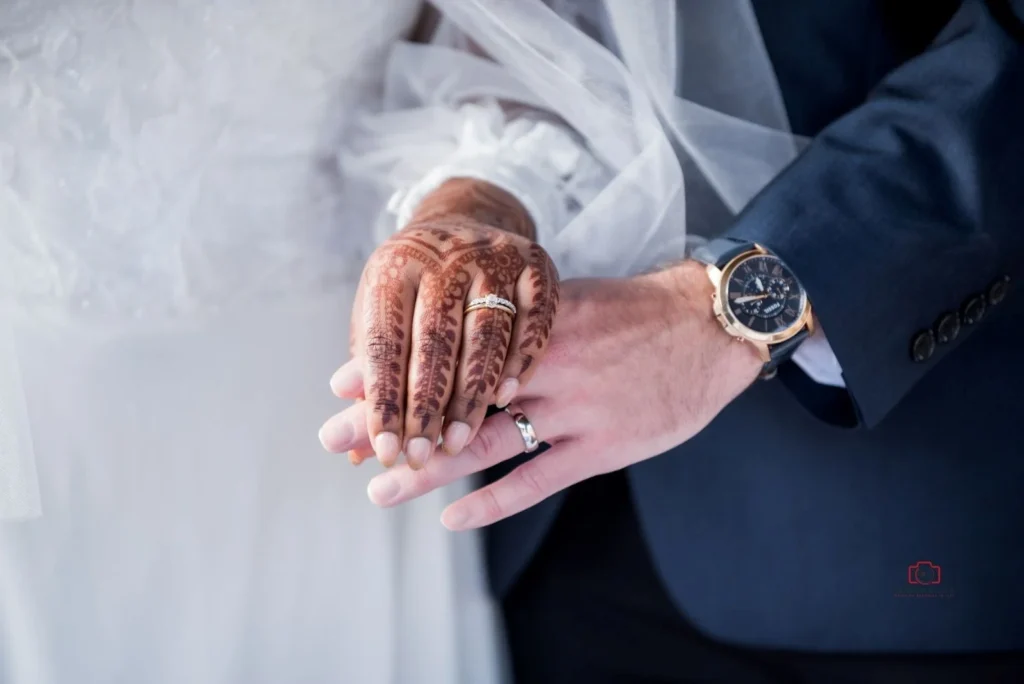 Newlywed couple showing wedding rings