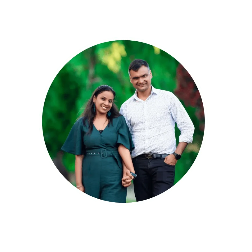 A couple, Ruchika Jain and Dinesh Jain, posing together in a beautiful outdoor setting for a photo captured wellington photographer