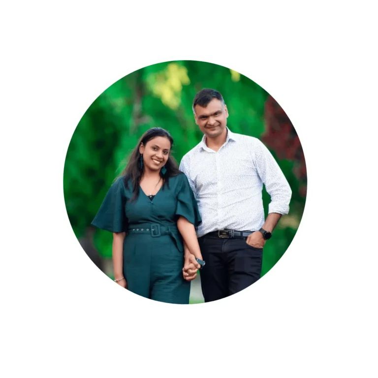 A couple, Ruchika Jain and Dinesh Jain, posing together in a beautiful outdoor setting for a photo captured wellington photographer