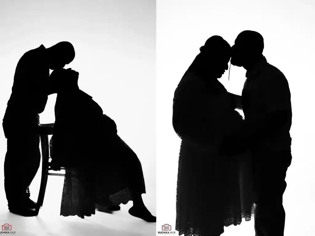 A stunning black-and-white silhouette maternity photoshoot in Wellington, capturing the love and anticipation of expecting parents