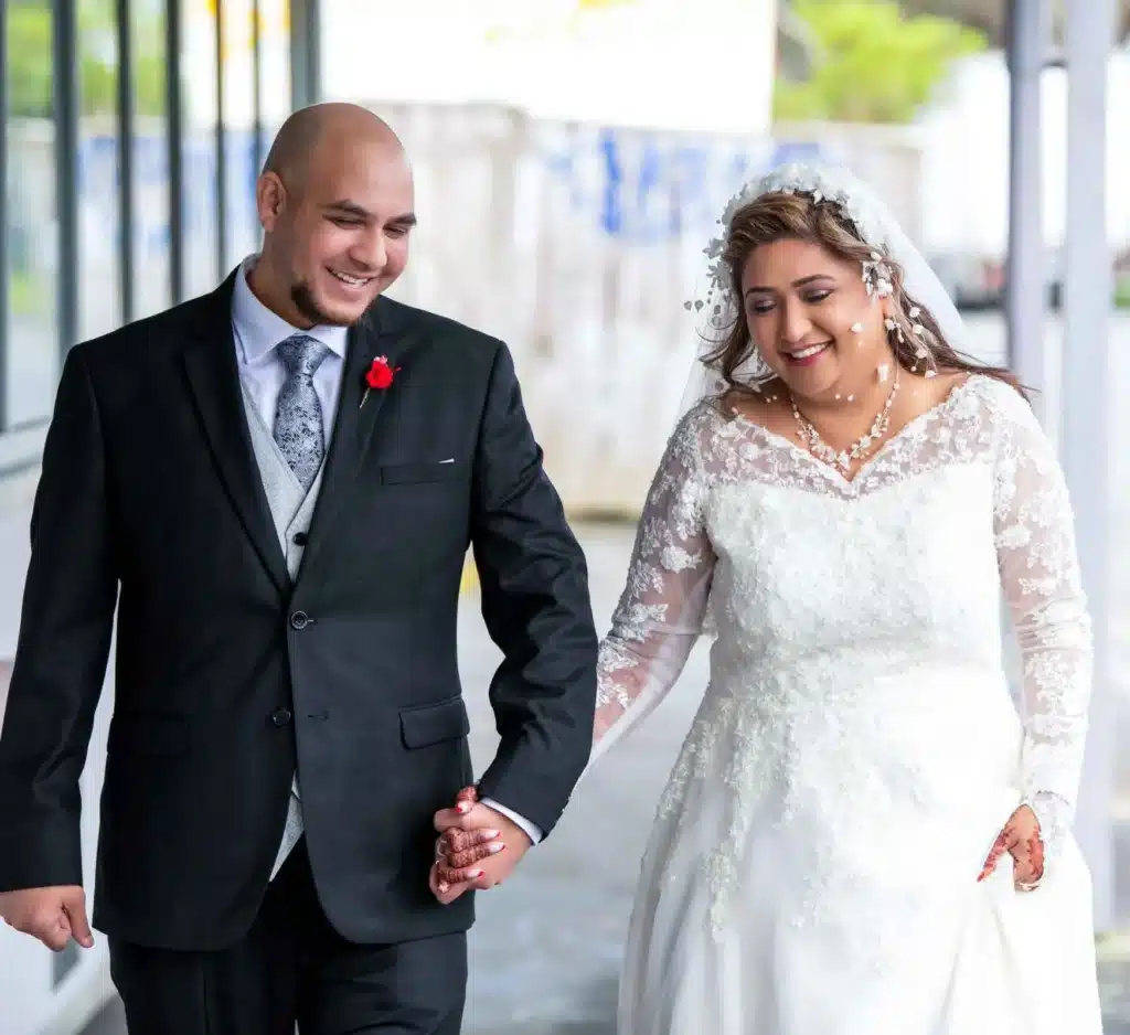 Wellington Wedding Photography - Happy newly wed couple walking together hands in hands towards a new journey.