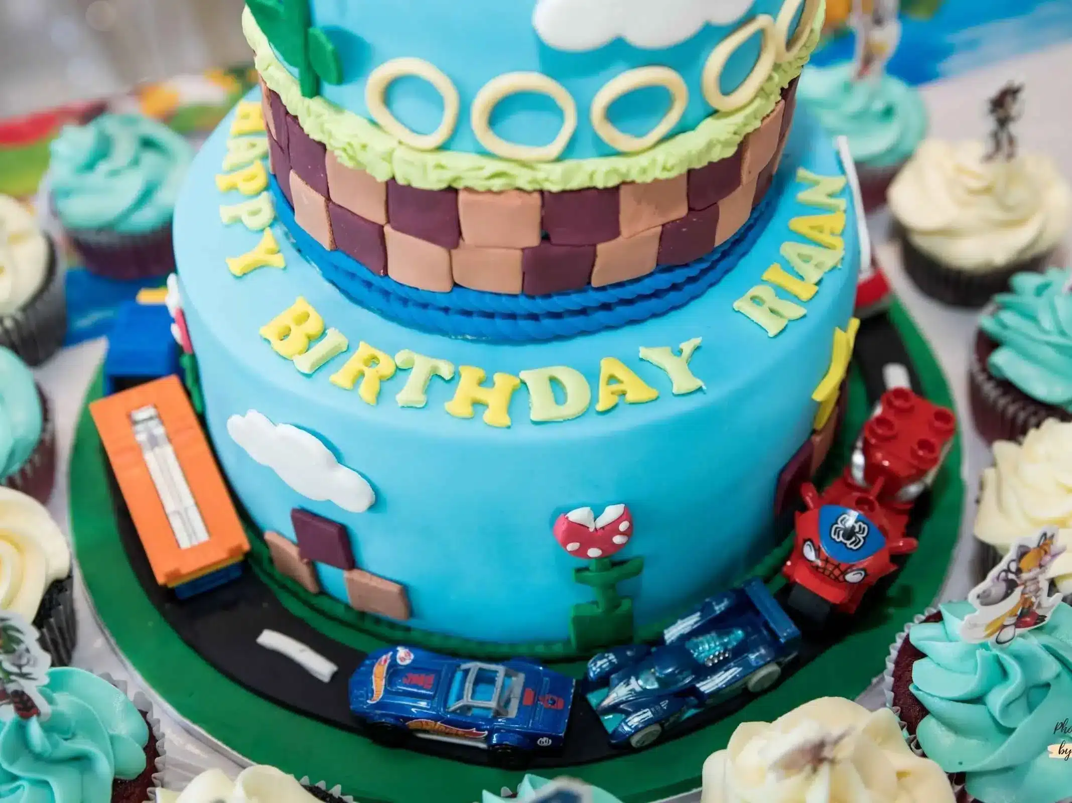 Celebrating Rian's Birthday: A delightful birthday cake with Rian's name on it, captured by Ruchika Jain Photography at a birthday party event in Wellington