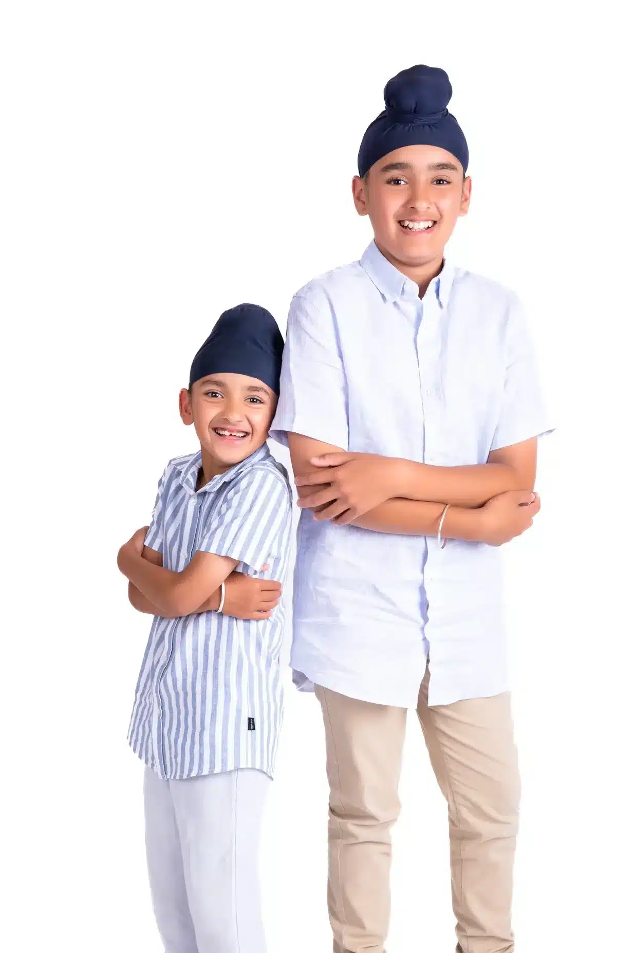 Two smiling brothers posing together during a studio kids photoshoot by Ruchika Jain Photography in Wellington.
