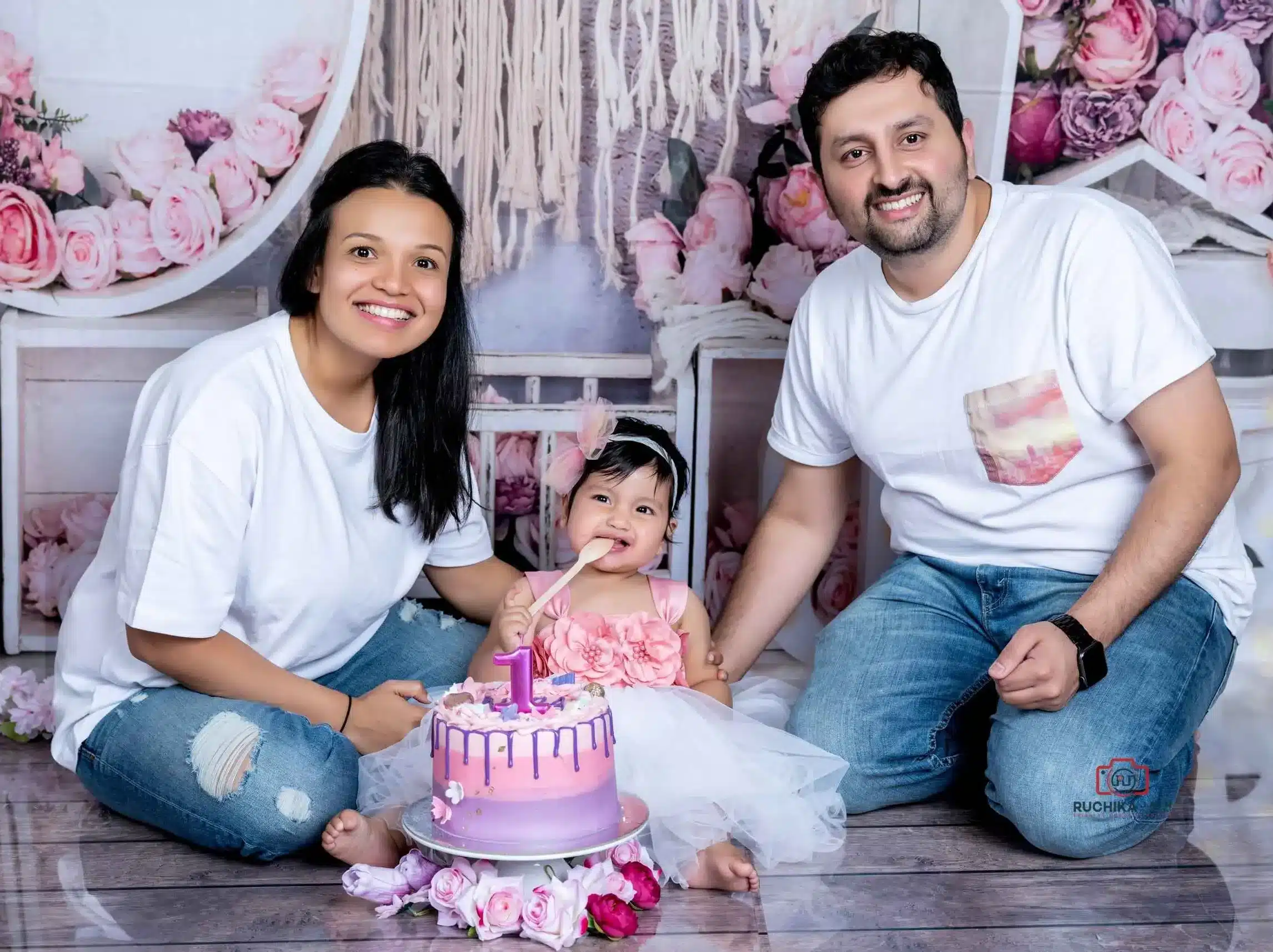 Cake smash celebration with a messy but joyful baby