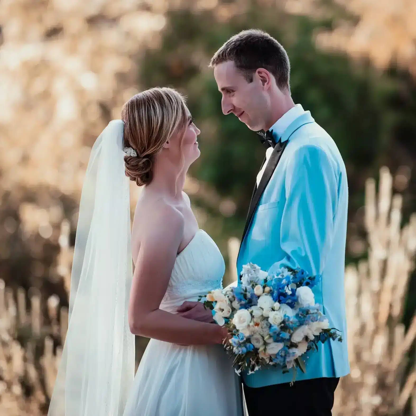 Couple posing for pre-wedding photography with pricing displayed