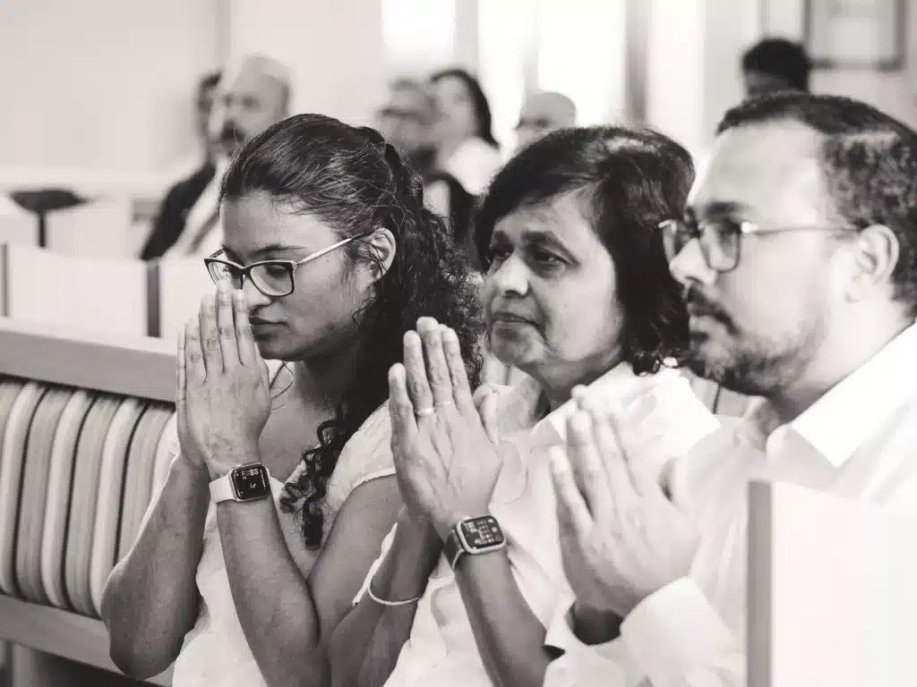Respectful Farewell: An Indian family pays their final respects to the departed soul at a funeral in Wellington, New Zealand, with hands together in a worshiping gesture