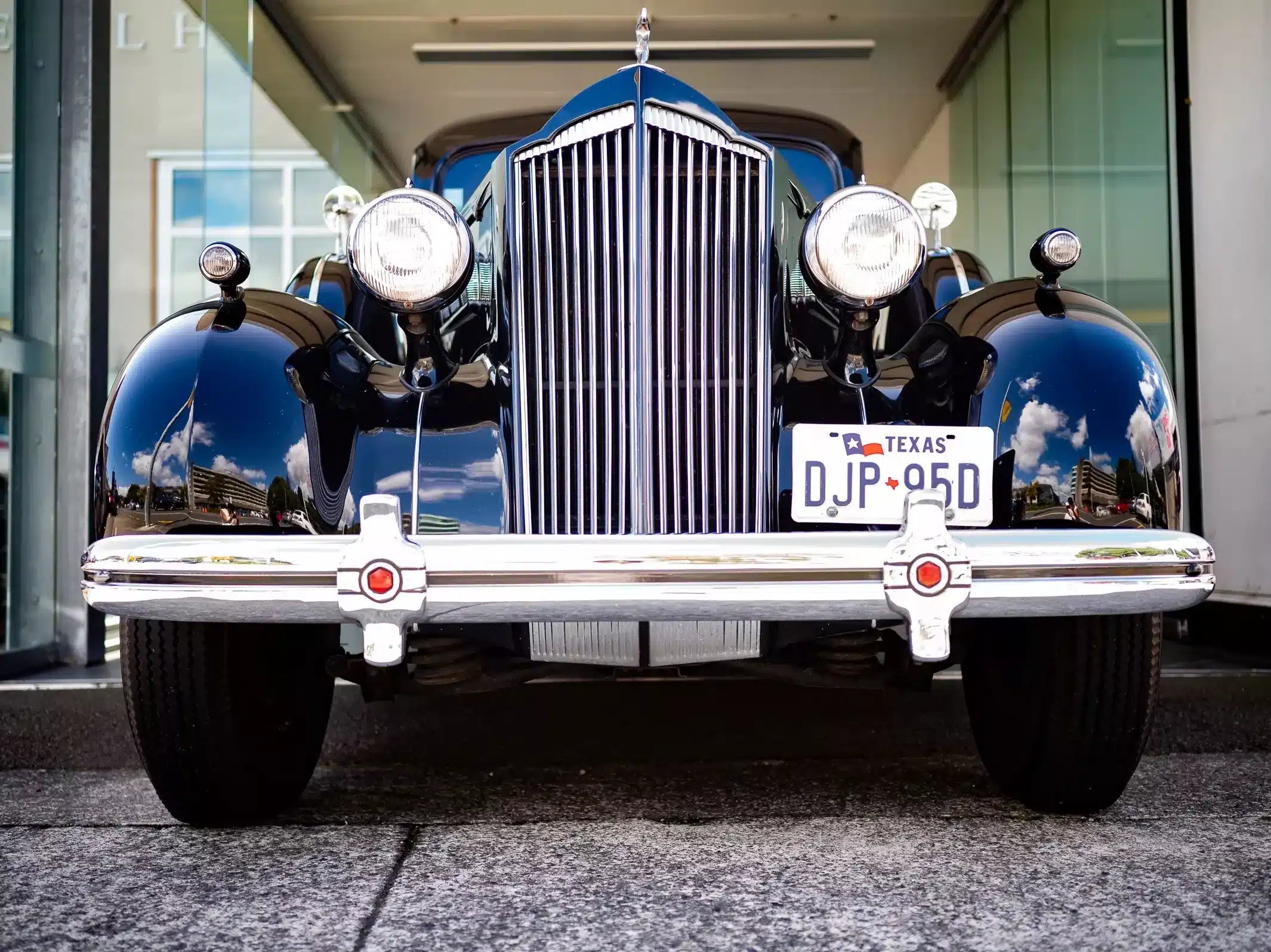 Funeral Hearse: A hearse carrying the coffin of the departed soul, solemnly waiting at a funeral in Wellington, New Zealand