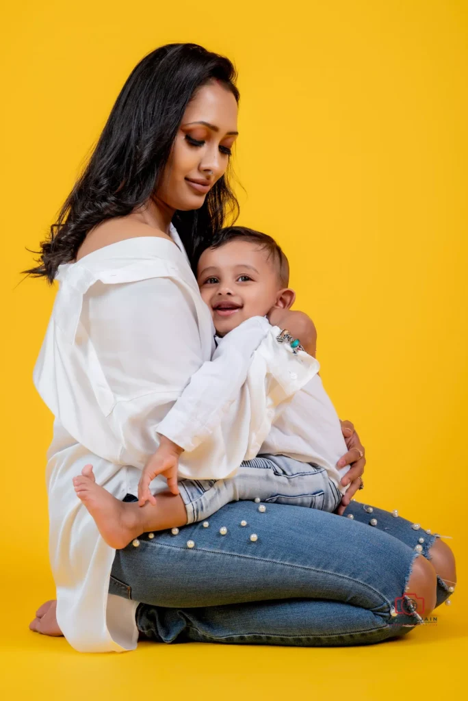 Adorable mother and son portrait in matching shirts with a vibrant colored background - Dress for Family Photoshoot Guide