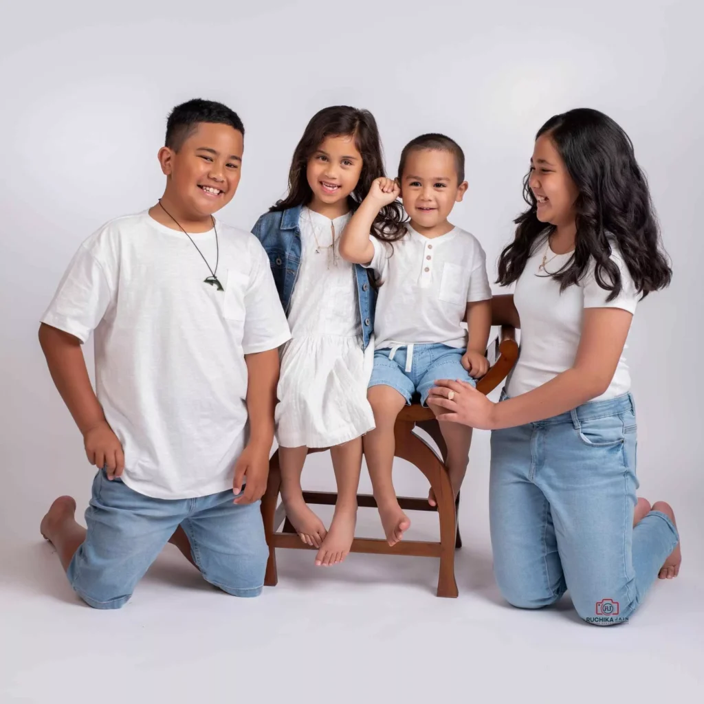 Charming family portrait of all kids with a serene grey background - Dress for Family Photoshoot Guide