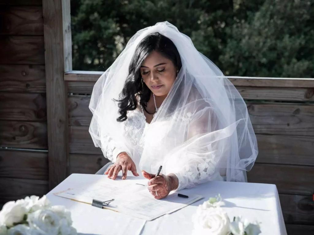 Stunning Wedding Photography - Bride Sitting in Beautiful Dress with Sun Rays in Wellington, New Zealand