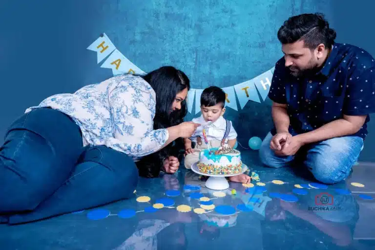 Charming cake smash portrait of a child enjoying their first birthday