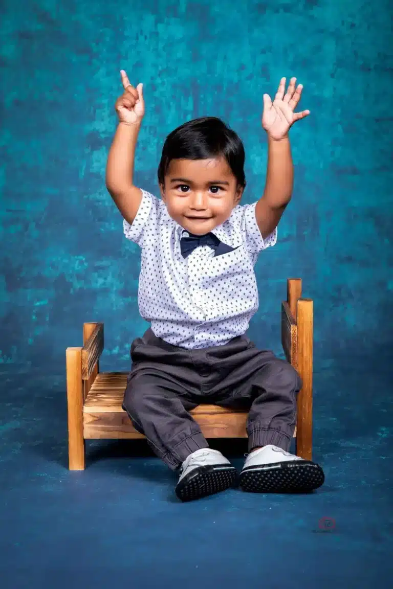 Happy child enjoying a cake smash photoshoot