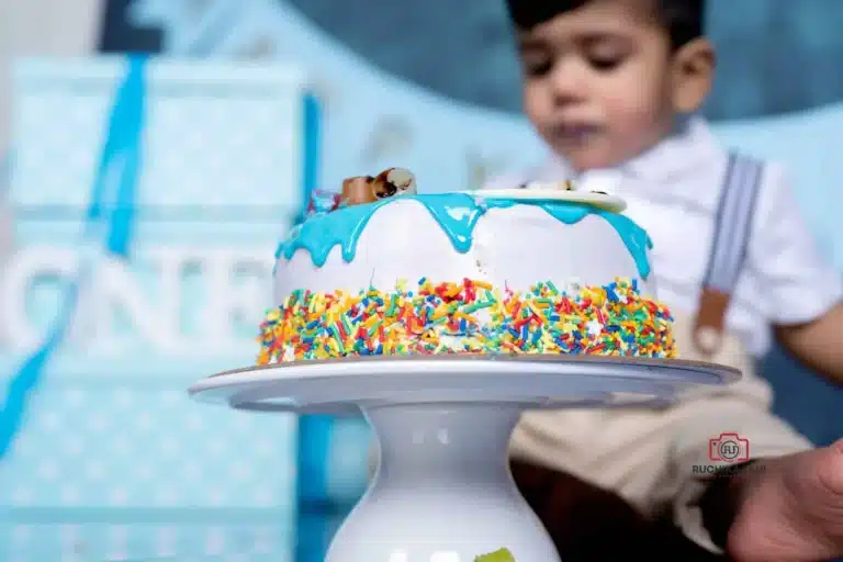 Toddler exploring the cake during a cake smash session