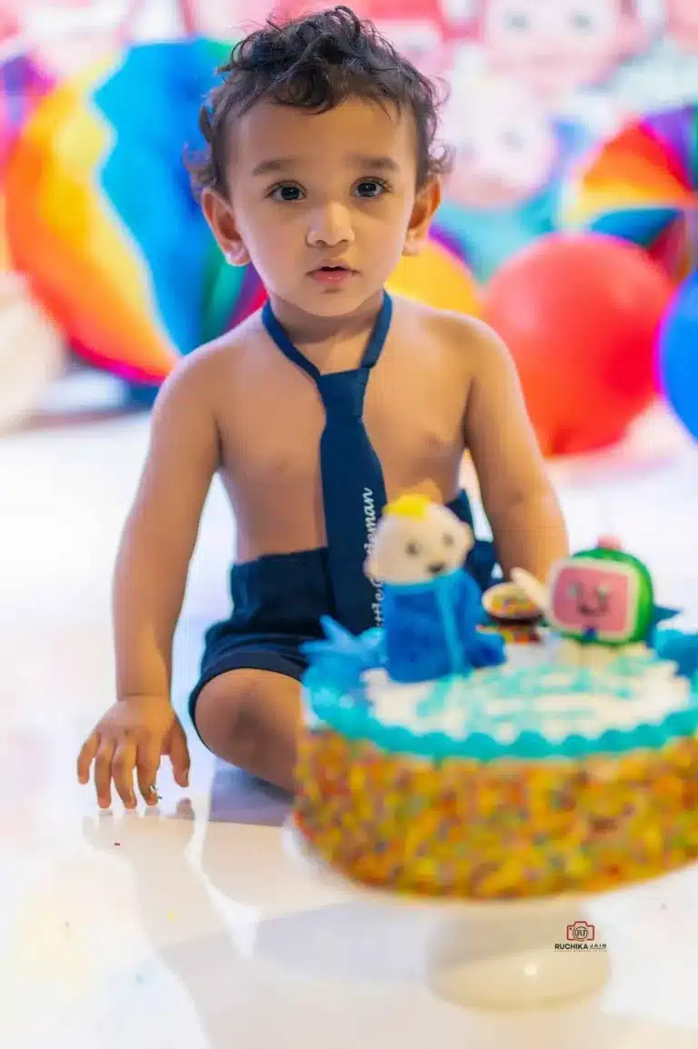 Whimsical cake smash photography highlighting the sweetness of childhood
