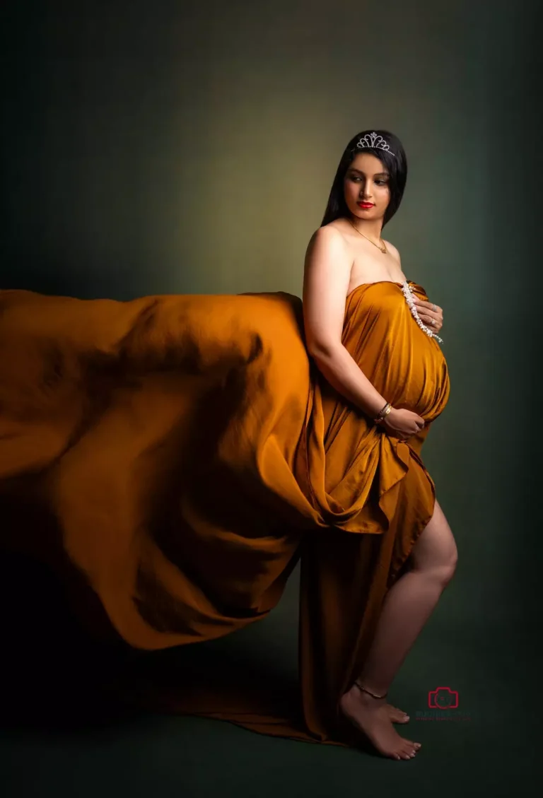 A radiant mother-to-be poses in a maternity photography session